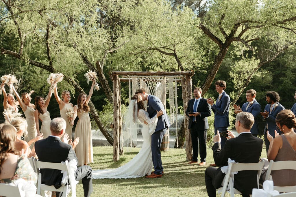 wedding couple first kiss