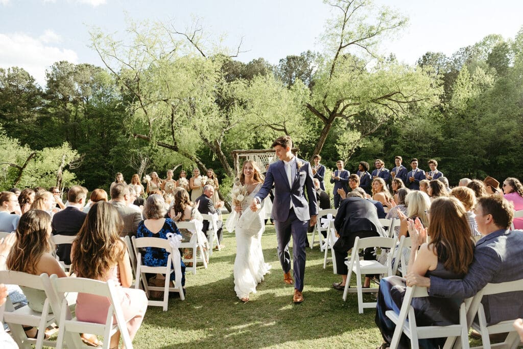 wedding couple walking down aisle