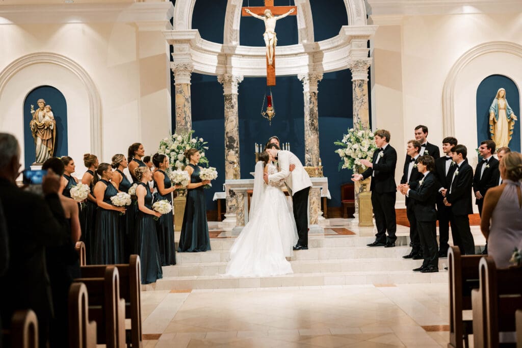 wedding couple first kiss