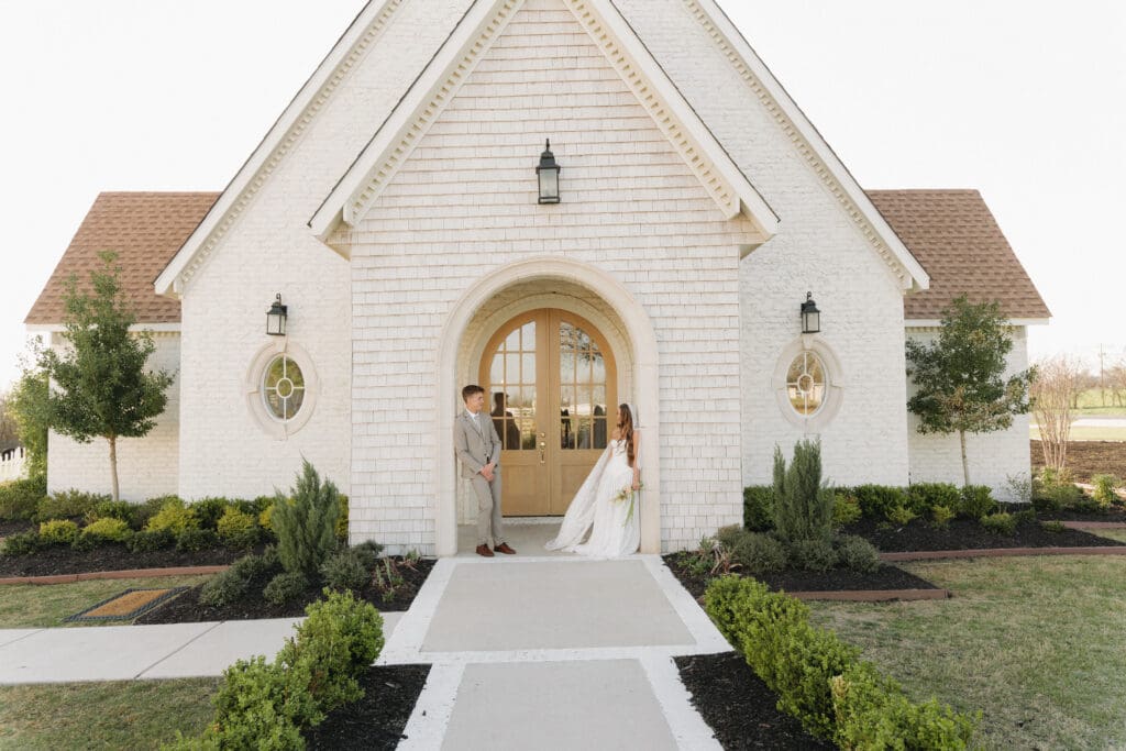 wedding couple in front of chapel
