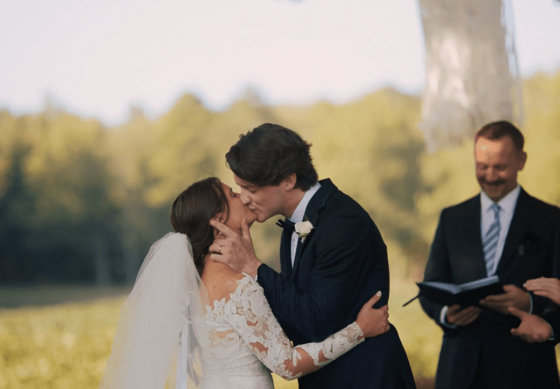 wedding couple first kiss